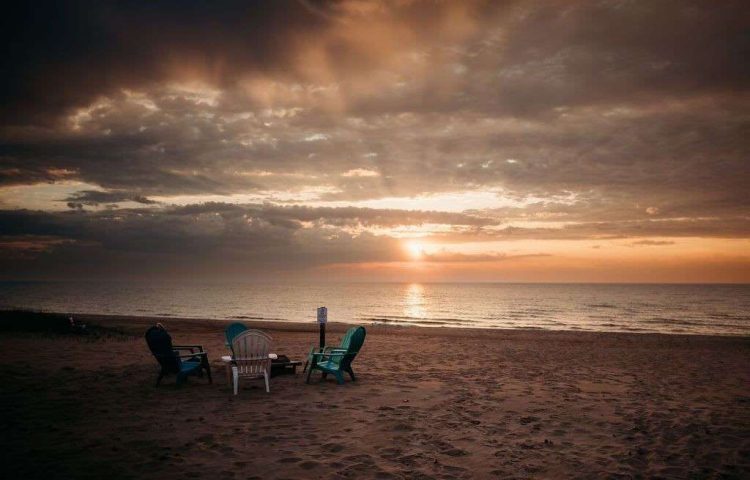 4 beach chairs on the beach